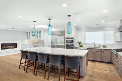 Example of a transitional brown floor kitchen design in San Francisco with stainless steel appliances