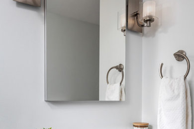Bathroom - mid-sized transitional kids' white tile and subway tile porcelain tile and single-sink bathroom idea in Boston with flat-panel cabinets, gray cabinets, a two-piece toilet, gray walls, an undermount sink, quartz countertops, white countertops and a built-in vanity