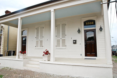 Inspiration for a timeless white one-story exterior home remodel in New Orleans