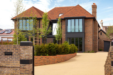 Photo of a large contemporary exterior in Sussex.