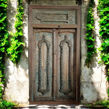 More is More: Moody Blue Carved Doors in Mogul Interior Wellness Decor