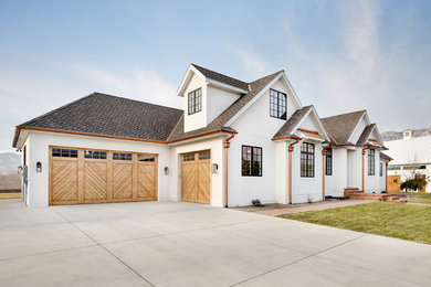 Example of an eclectic white house exterior design in Salt Lake City