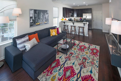 Inspiration for a small contemporary open concept dark wood floor living room remodel in Wilmington with gray walls and a wall-mounted tv