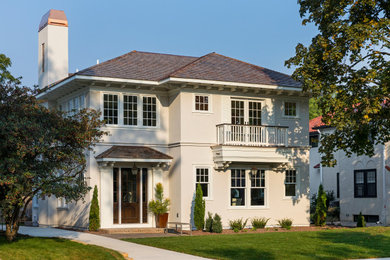 Tuscan two-story mixed siding house exterior photo in Minneapolis with a hip roof and a green roof