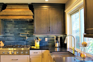 Inspiration for a transitional u-shaped porcelain tile and gray floor kitchen remodel in San Francisco with a farmhouse sink, shaker cabinets, granite countertops, blue backsplash, ceramic backsplash and paneled appliances