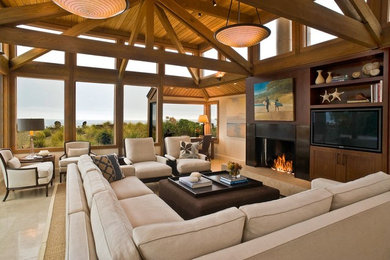 Design ideas for a large beach style enclosed family room in San Francisco with a standard fireplace, a built-in media wall, beige walls, porcelain floors and a tile fireplace surround.