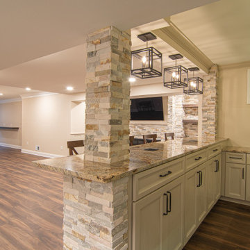 Basement Showing Warm Colors, Straight Lined Cabinets and Stacked Stone