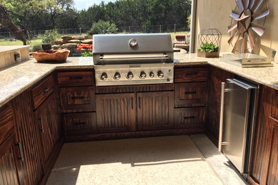 Example of a mountain style patio design in Austin