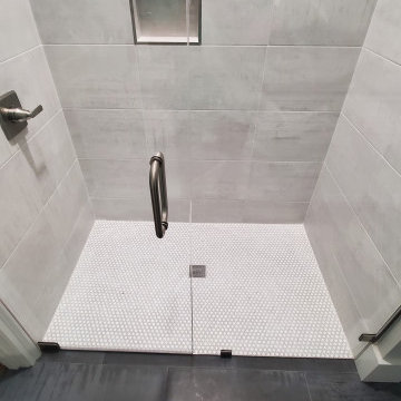 Elegant Shower done with 12x24 tiles and penny rounds.