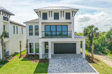 Example of a mid-sized transitional white two-story stucco house exterior design in Jacksonville