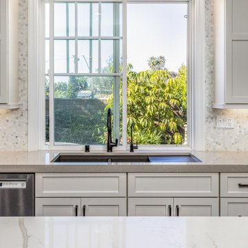 Coastal Estate Kitchen Design and Remodel with White Cabinets and Dark Fixtures