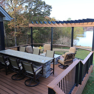 Custom curved, multilevel deck with bar and firepit - Innsbrook, MO