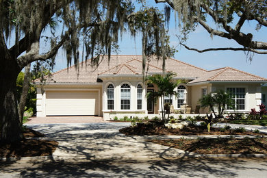 Tuscan home design photo in Tampa