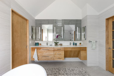 Inspiration for a contemporary master porcelain tile and double-sink freestanding bathtub remodel in Omaha with flat-panel cabinets, quartzite countertops and a floating vanity