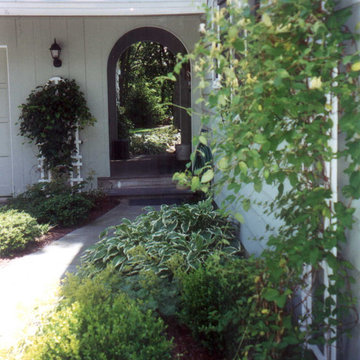 An arched door leads to the backyard