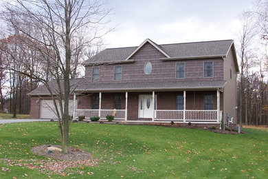 Inspiration for a large brown two-story exterior home remodel in Other