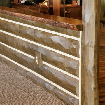 Counter made with half log hewn siding with chinking