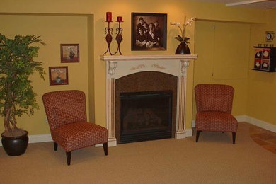 Open concept carpeted living room photo in Detroit with yellow walls, a standard fireplace and a metal fireplace