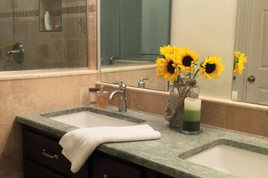 Mid-sized elegant master beige tile and stone tile travertine floor double shower photo in Richmond with dark wood cabinets, a two-piece toilet, beige walls, an undermount sink and granite countertops