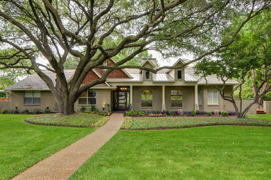 Example of a large minimalist split-level wood exterior home design in Dallas