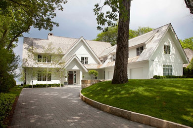 Transitional white wood gable roof photo in Minneapolis
