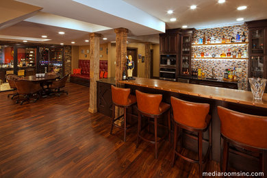 Inspiration for a large transitional walk-out basement in Wilmington with a home bar, beige walls, dark hardwood floors and brown floor.