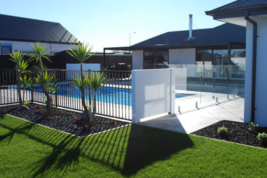 Photo of a large tropical backyard garden in Christchurch.