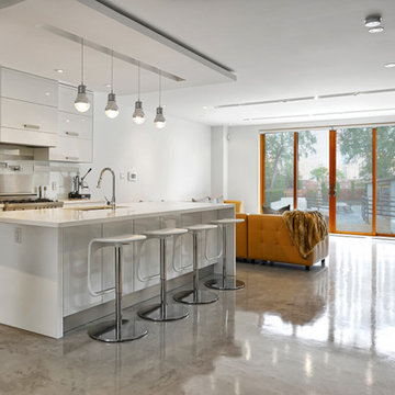 White Kitchen with Concrete Flooring