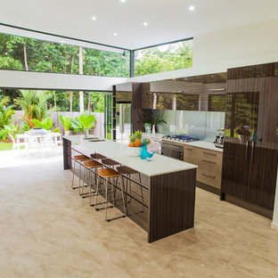 Contemporary kitchen pantry ideas - Inspiration for a contemporary galley porcelain floor kitchen pantry remodel in Cairns with an undermount sink, granite countertops, metallic backsplash, glass sheet backsplash, stainless steel appliances and an island