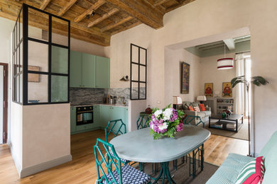 This is an example of an eclectic dining room in Rome.