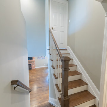 Staircases leading down to main level & up to new master bedroom suite