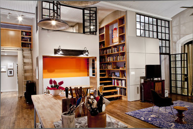 Design ideas for a contemporary open concept living room in New York with a library.