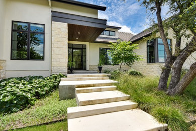 Mid-sized transitional beige one-story exterior home idea in Austin