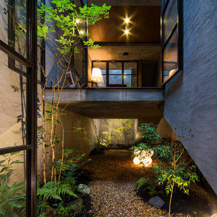 他の地域のアジアンスタイルのおしゃれな庭 (日陰、砂利舗装) の写真