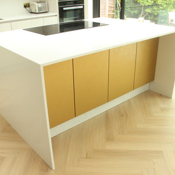 Contemporary Two-Toned Kitchen with Golden Accents