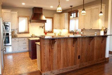 Example of an arts and crafts kitchen design in Charlotte