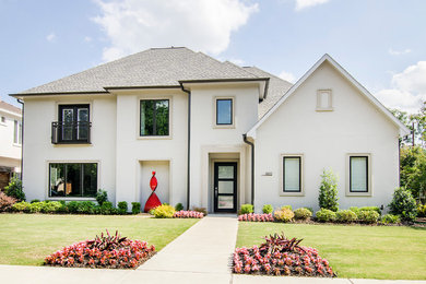 Photo of a large contemporary two-storey stucco white exterior in Dallas.