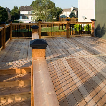 Smith - Cedar deck in Kansas City with stamped concrete patio.