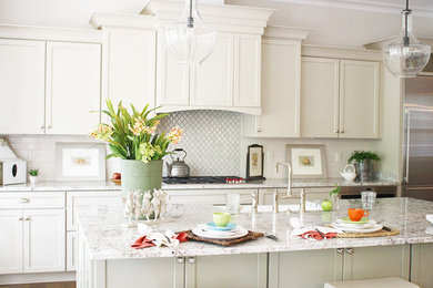 Transitional l-shaped medium tone wood floor open concept kitchen photo in Richmond with a farmhouse sink, shaker cabinets, granite countertops, white backsplash, subway tile backsplash, stainless steel appliances and an island