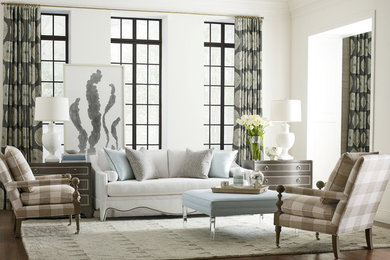 Inspiration for a large transitional formal and open concept medium tone wood floor and brown floor living room remodel in Boston with white walls, no fireplace and no tv