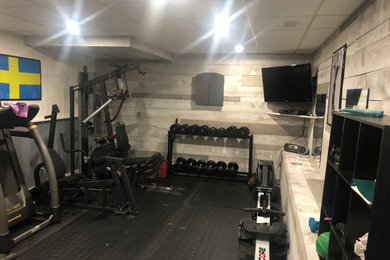 Home weight room - mid-sized farmhouse black floor home weight room idea in Toronto with gray walls