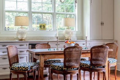 Enclosed dining room - large traditional dark wood floor enclosed dining room idea in Chicago with white walls and no fireplace