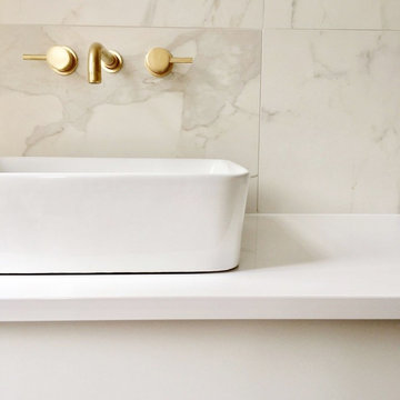 Principal ensuite with satin brass details
