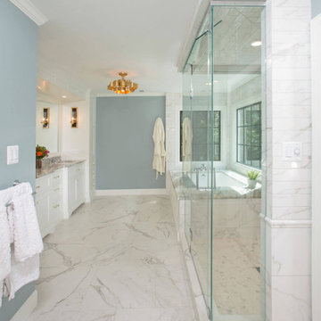 Elegant Bathroom with Frameless Hinged Glass Enclosure and Large Mirror