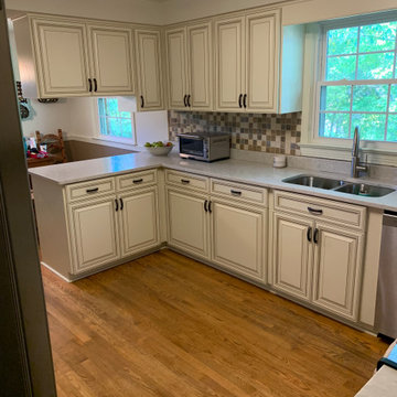 Cabinet reface antique white cabinets.. quartz countertop