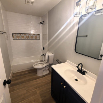 Rent-Ready Bath with Navy Vanity and Subway Tile