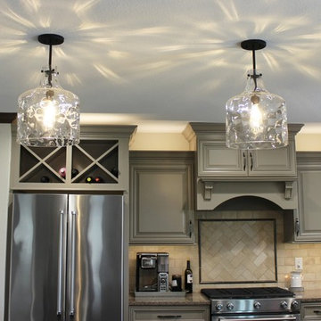 Farmhouse kitchen Taupe Painted Cabinets,Quartz Tops, and Dark Island