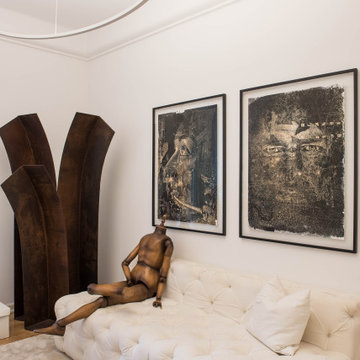 White Tufted Sofa with Corten Sculpture and Art in Lisbon
