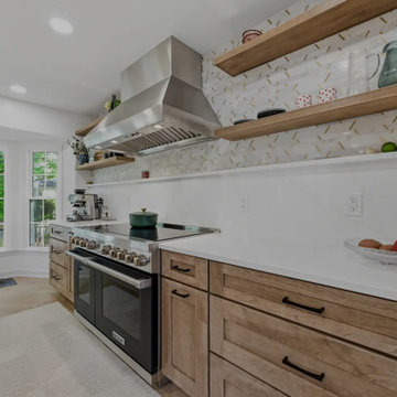 Warm Cherry Kitchen and Powder Room Remodel with Waterfall Island in Herndon, VA