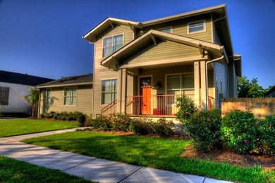 Green two-story vinyl exterior home idea in New Orleans